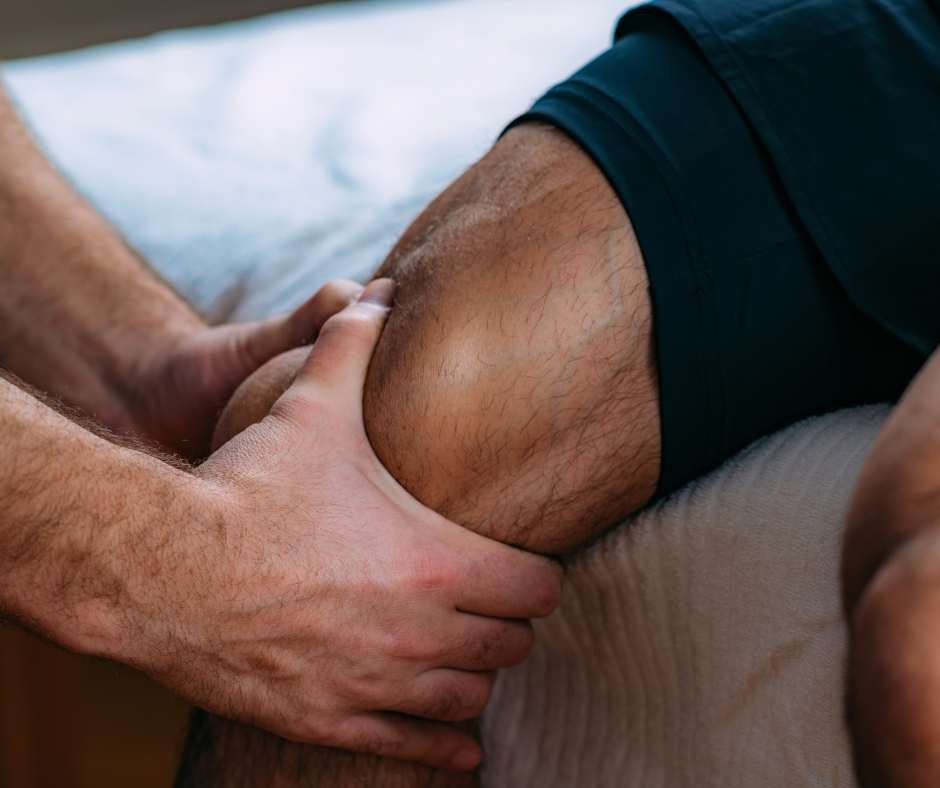 Close-up of Stepan working on a client's leg